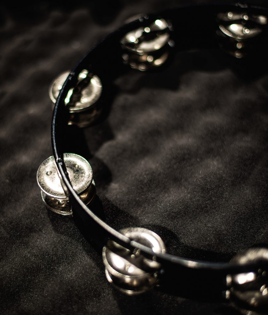 Close-up of a tambourine on a padded case.