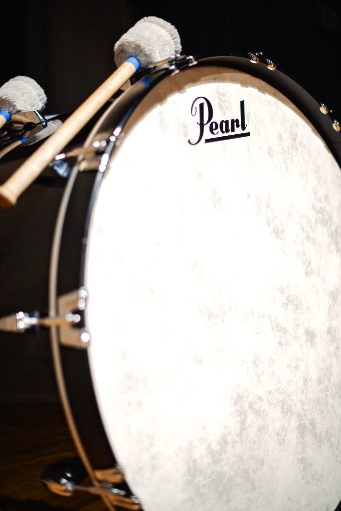 Large concert bass drum with fluffy mallets.