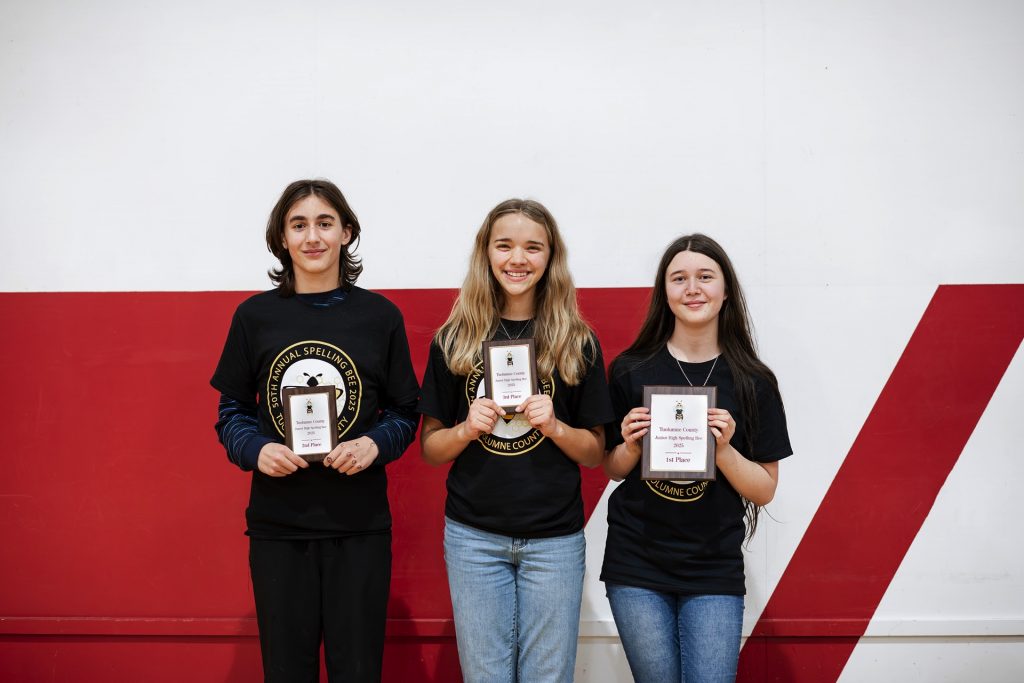 The top three winners of the 50th Annual Tuolumne County Spelling Bee holding their plaques.