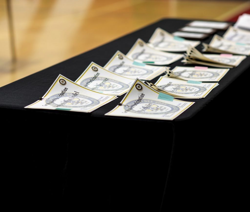 Certificates of participation displayed on a table at the 50th Annual Tuolumne County Spelling Bee.